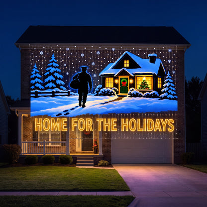 HOME FOR THE HOLIDAYS design lit across the side wall of a house at night